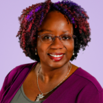 Black female, black, aurburn and purple short hair, purple dress